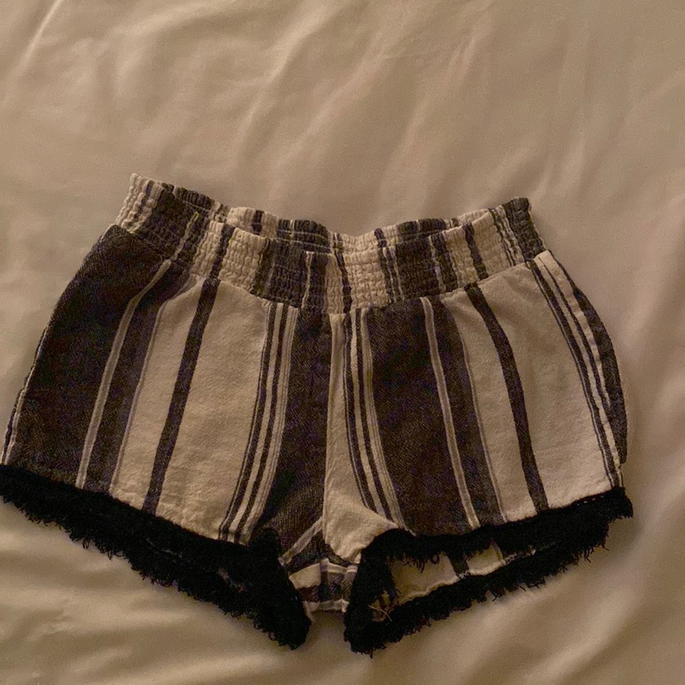 Super cute black and white striped shorts, fringed bottom